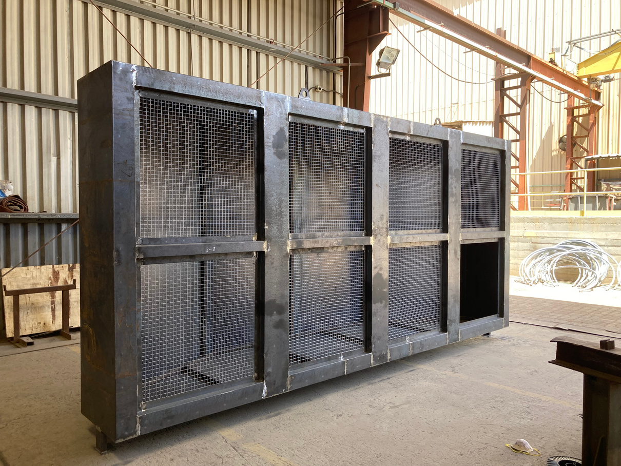 A large sheet metal box with steel mesh welded on one side
