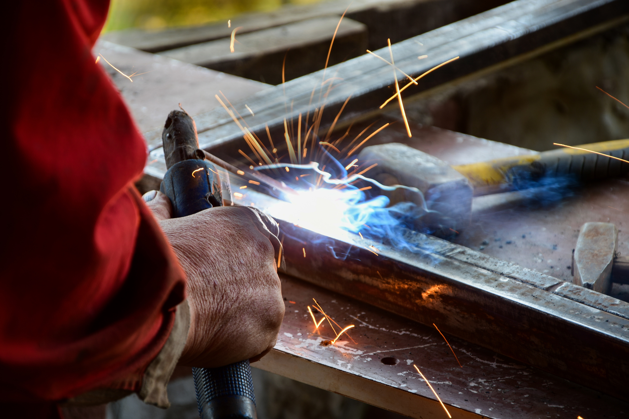 A man is shown welding square hollow section